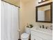 Bright bathroom with a shower, toilet, and vanity with modern fixtures and decor at 4393 E Andover Ave, Castle Rock, CO 80104