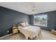 Cozy bedroom with a ceiling fan and natural light at 4393 E Andover Ave, Castle Rock, CO 80104