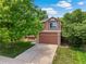 Charming two-story home with a well-maintained lawn and mature trees providing shade at 4393 E Andover Ave, Castle Rock, CO 80104