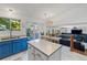 Open kitchen and dining area, featuring a large island and plenty of counter space at 4393 E Andover Ave, Castle Rock, CO 80104