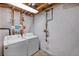 Basement laundry area with washer, dryer, and shelving for storage at 4393 E Andover Ave, Castle Rock, CO 80104