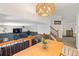 Cozy living room featuring an open staircase, modern lighting, and comfortable seating at 4393 E Andover Ave, Castle Rock, CO 80104