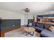 Comfortable living room featuring modern decor, hardwood floors, and an open layout at 4393 E Andover Ave, Castle Rock, CO 80104