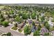 Aerial view showcasing a neighborhood with well-maintained homes, mature trees, and a sense of community at 4393 E Andover Ave, Castle Rock, CO 80104