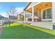 Backyard featuring artificial turf, patio with outdoor seating and easy access to the home at 2594 Scoter Ln, Castle Rock, CO 80104