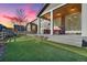 Backyard featuring artificial turf, patio with outdoor seating and easy access to the home at 2594 Scoter Ln, Castle Rock, CO 80104