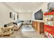 Basement living area with a large sectional, wood-look floors, and a vintage-style popcorn machine at 2594 Scoter Ln, Castle Rock, CO 80104