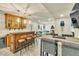 Finished basement with wooden bar, barstool seating, and an adjacent entertainment area at 2594 Scoter Ln, Castle Rock, CO 80104