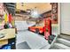 Spacious garage features an epoxy floor, ample storage, and room for parking with custom wall decor at 2594 Scoter Ln, Castle Rock, CO 80104