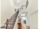 Open foyer with staircase, chandelier, and view into dining room at 2594 Scoter Ln, Castle Rock, CO 80104