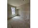 Bedroom under construction featuring natural light from window and closet space at 30 Waterford St, Erie, CO 80516
