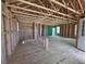 Bright, unfinished interior showcasing the home's frame, beams, and open layout ready for customization at 30 Waterford St, Erie, CO 80516