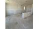 Spacious living room under construction with drywall and natural light from the windows at 30 Waterford St, Erie, CO 80516