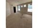 Bright living room with large windows under construction at 30 Waterford St, Erie, CO 80516