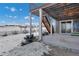 Backyard with snowy landscape and deck at 2648 Fair Meadow Pl, Castle Rock, CO 80104