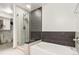 Modern bathroom featuring a glass-enclosed shower and a separate soaking tub for a spa-like experience at 891 14Th St # 1408, Denver, CO 80202