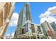 Modern high-rise building showcasing contemporary architecture, set against a bright blue sky at 891 14Th St # 1408, Denver, CO 80202
