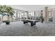 Bright game room features a pool table, lounge area, large windows, and access to an outdoor terrace at 891 14Th St # 1408, Denver, CO 80202