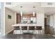 Modern kitchen with an island, bar seating, stainless steel appliances, and pendant lighting at 891 14Th St # 1408, Denver, CO 80202