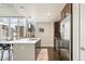Bright modern kitchen featuring stainless steel appliances, white countertops, and stunning city views at 891 14Th St # 1408, Denver, CO 80202
