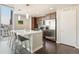 Modern kitchen featuring an island with bar seating, stainless steel appliances, and sleek cabinetry at 891 14Th St # 1408, Denver, CO 80202