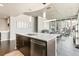 Stylish kitchen featuring stainless steel appliances, quartz countertops, and modern lighting at 891 14Th St # 1408, Denver, CO 80202