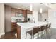 Modern kitchen showcasing stainless steel appliances, white countertops, and stylish bar seating at 891 14Th St # 1408, Denver, CO 80202