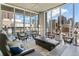 Bright and airy living room featuring expansive windows with stunning city views and sleek modern decor at 891 14Th St # 1408, Denver, CO 80202