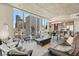Spacious living room featuring floor-to-ceiling windows with panoramic city views and stylish furnishings at 891 14Th St # 1408, Denver, CO 80202
