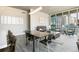 Open-concept living and dining area showcasing modern decor and city views from large windows at 891 14Th St # 1408, Denver, CO 80202