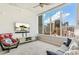 Bright living room boasting floor-to-ceiling windows with stunning city views and comfortable seating arrangements at 891 14Th St # 1408, Denver, CO 80202