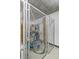 An indoor storage cage with personal items and a bike at 891 14Th St # 1408, Denver, CO 80202