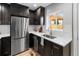 Well-appointed kitchen with stainless steel appliances, sleek hardware, and ample counter space at 3210 Magnolia St, Denver, CO 80207