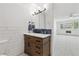 Bathroom featuring updated vanity and adjacent bedroom with abundant light at 660 S Alton Way # 3B, Denver, CO 80247