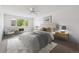 Bright bedroom with a large window, neutral decor, and a comfortable queen-sized bed at 660 S Alton Way # 3B, Denver, CO 80247