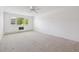 Spacious bedroom featuring neutral carpet, a window, and ample natural light at 660 S Alton Way # 3B, Denver, CO 80247