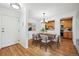 Cozy dining area with wood floors, a chandelier, and a view into the kitchen at 660 S Alton Way # 3B, Denver, CO 80247