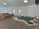 Image of the indoor hot tub with wood bench seating near the window at 660 S Alton Way # 3B, Denver, CO 80247