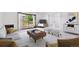 Bright living room featuring a balcony, contemporary furniture, and neutral tones at 660 S Alton Way # 3B, Denver, CO 80247