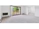 Bright living room with balcony access offering outdoor views and lots of natural light at 660 S Alton Way # 3B, Denver, CO 80247