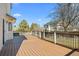 Spacious back deck with wood flooring and black railing, perfect for outdoor entertaining at 5276 S Danube St, Centennial, CO 80015