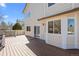 Back deck with wood flooring, accessible from the house, providing an outdoor living space at 5276 S Danube St, Centennial, CO 80015