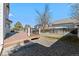 Backyard featuring a wood deck, stone feature, and grass at 5276 S Danube St, Centennial, CO 80015