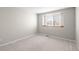 Bedroom featuring neutral carpet, light gray walls and a window for natural light at 5276 S Danube St, Centennial, CO 80015
