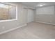 Basement bedroom with neutral carpet, closet, and natural light from the window at 5276 S Danube St, Centennial, CO 80015