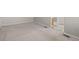 This bedroom features neutral carpeting, grey walls, and a peek into the bathroom at 5276 S Danube St, Centennial, CO 80015