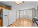A kitchen-adjacent breakfast nook with a view of a bay window for lots of natural light and outdoor views at 5276 S Danube St, Centennial, CO 80015