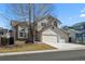 Charming two-story home with a well-maintained lawn, a two car garage, and a traditional design at 5276 S Danube St, Centennial, CO 80015