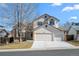 Charming two-story home with a well-maintained lawn, a two car garage, and a traditional design at 5276 S Danube St, Centennial, CO 80015