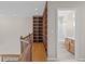 Hallway with a built-in bookcase and a view into the bathroom with a shower and vanity at 5276 S Danube St, Centennial, CO 80015